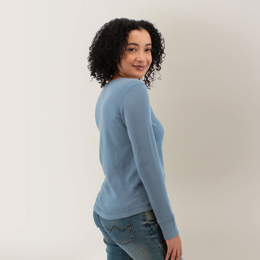 Old Ranch faded denim waffle-knit long-sleeve T-shirt, front three-quarter view on model with jeans, relaxed fit and curved hem