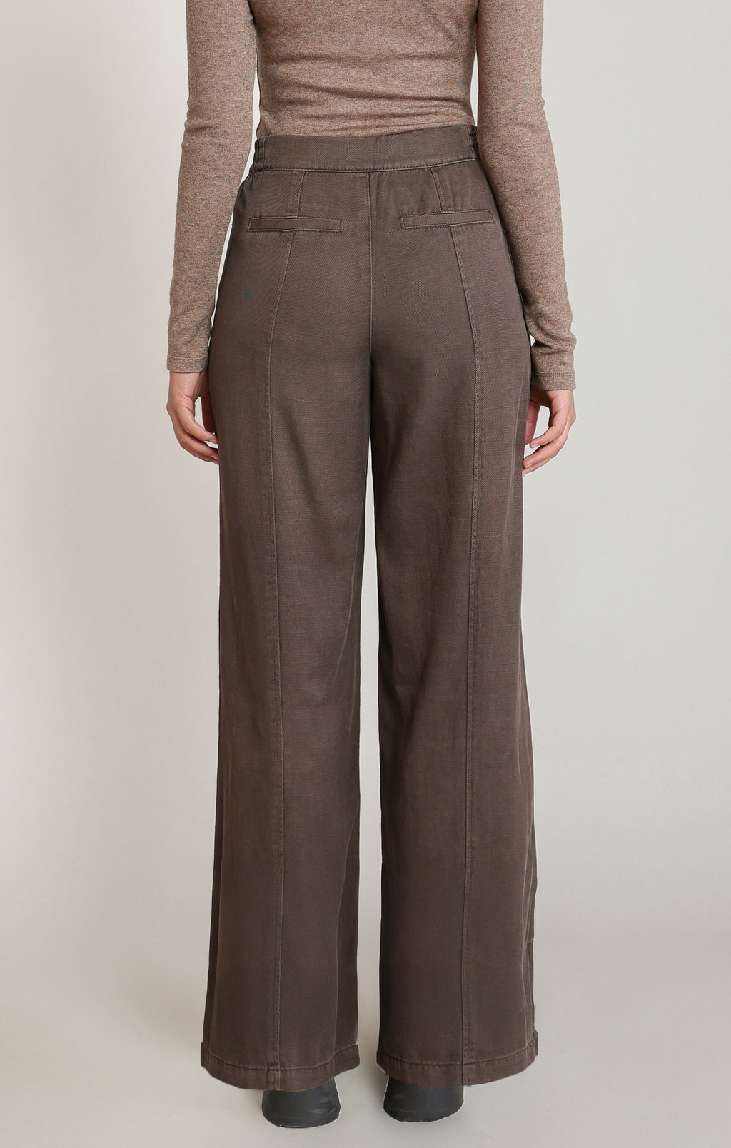  Dex brown twill wide leg pants front view, worn with a taupe knit top, showing the elastic waistband, front patch pockets and center seam